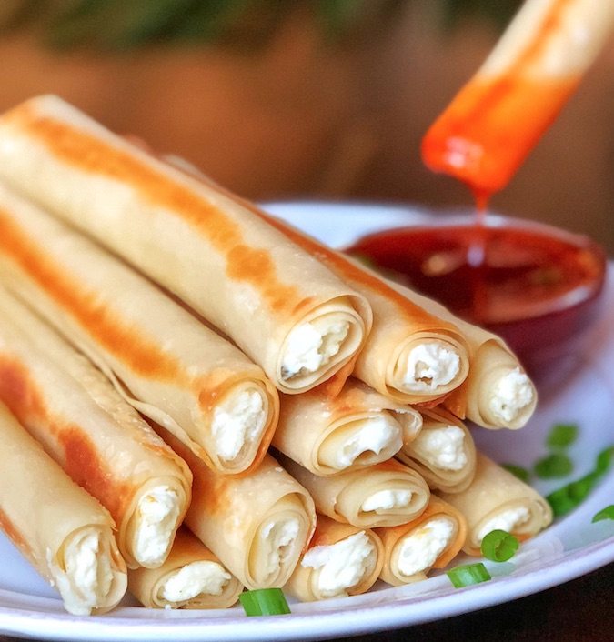 Amazing Baked Cream Cheese Rangoon Rolls -- Fun and easy homemade snacks to make! These taste just like panda express, only they are baked instead of fried. So quick and easy to make with just a few simple ingredients.