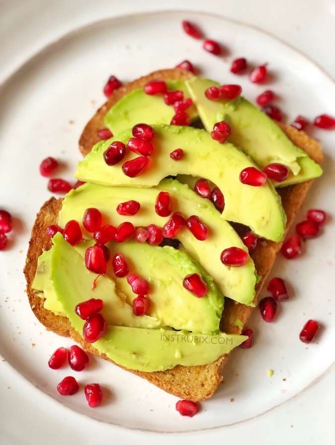 Winter Breakfast Idea! Simple Healthy Avocado Toast Breakfast Recipe made with pomegranate seeds! This is also delicious for lunch or a mid day snack. Healthy pomegranate recipe. Perfect for Christmas and holidays! Even the kids will love this. Instrupix.com 