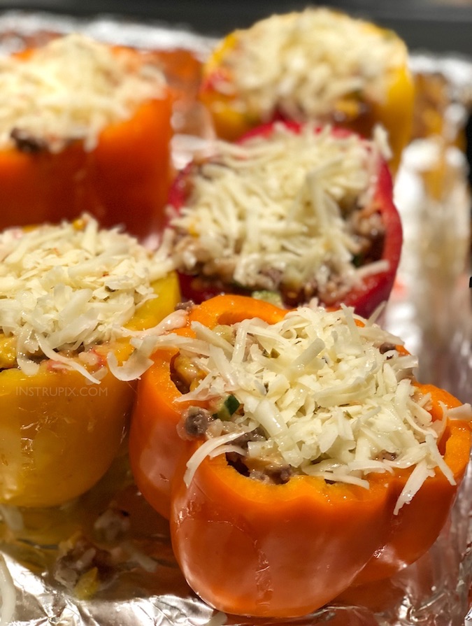 The BEST easy stuffed bell peppers recipe, ever! Using ground beef (or ground turkey), cheese, zucchini, corn, tomatoes and rice! Bake them in the oven, and enjoy this easy and healthy dinner recipe for the family. Instrupix.com