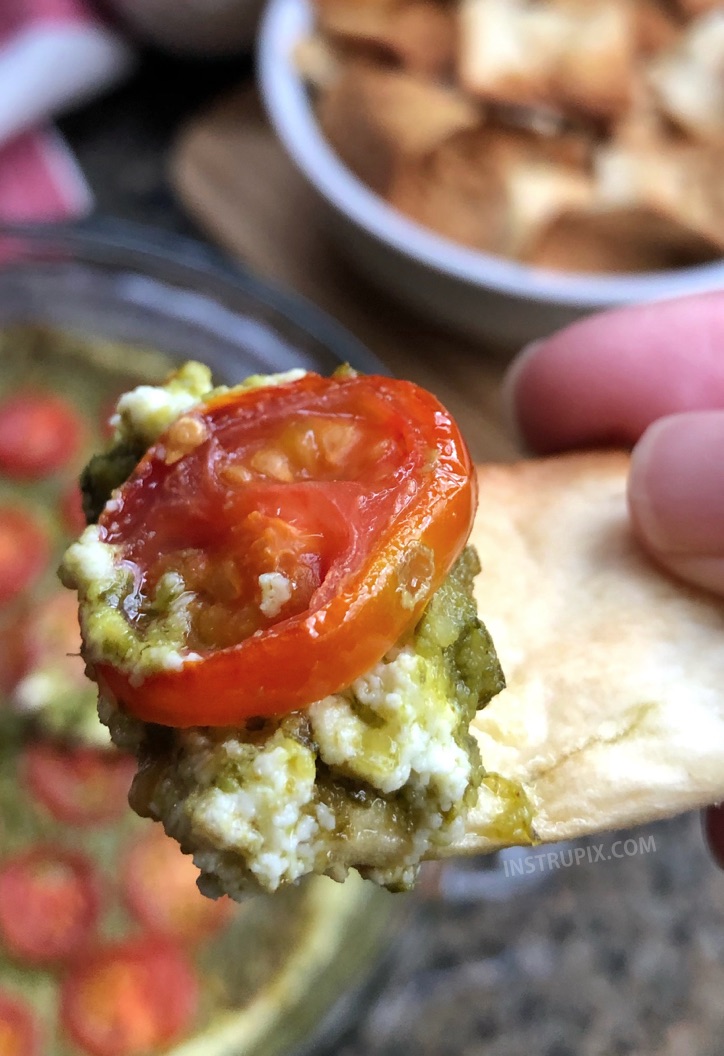 OMG!! Warm Caprese Cheese Dip Recipe - This easy appetizer dip for a party is a real crowd pleaser! Just 3 ingredients! Cream cheese, basil pesto and tomatoes. It's perfect served with pita chips, bread or crackers. | #instrupix #appetizers #diprecipes #partyfood #caprese #basilpesto #creamcheese