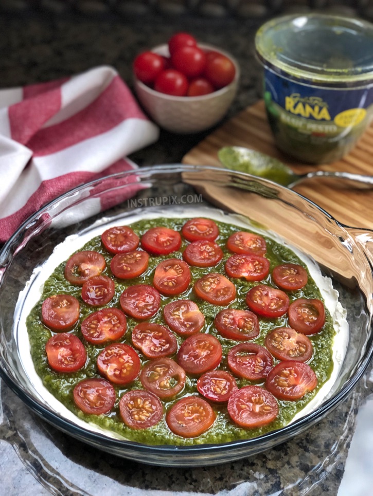 3 Ingredient Warm Caprese Dip Recipe - This easy appetizer dip for a party is a real crowd pleaser! Made with cream cheese, basil pesto and tomatoes. It's perfect served with pita chips, bread or crackers. | #instrupix #appetizers #diprecipes #partyfood #caprese #basilpesto #creamcheese