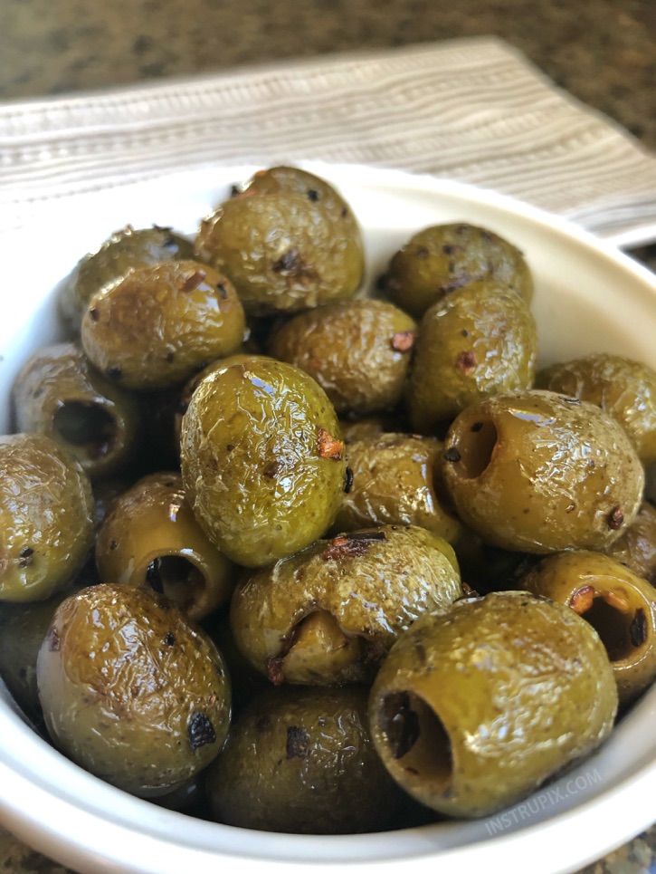 Blistered Green Olives - YUM! This easy low carb snack idea is perfect for on the go! They are also the most savory little keto party snacks to accompany a cheese board. | Instrupix #keto #lowcarb #greenolives #instrupix 