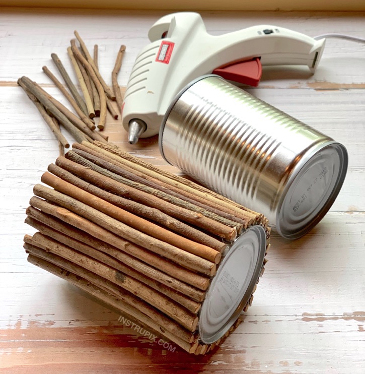 DIY Tin Can Makeover -- using sticks and hot glue! 6 Charming Ways To Dress Up A Tin Can