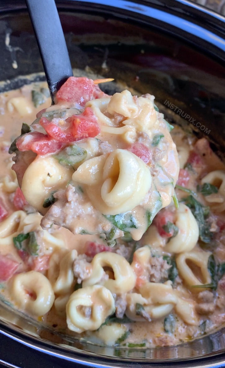 Looking for easy crockpot soup recipes? This simple dinner idea is made with just a handful of cheap ingredients! Creamy Sausage and Tortellini Crockpot Soup Recipe -- Easy to make in your slow cooker! The entire family will love it.