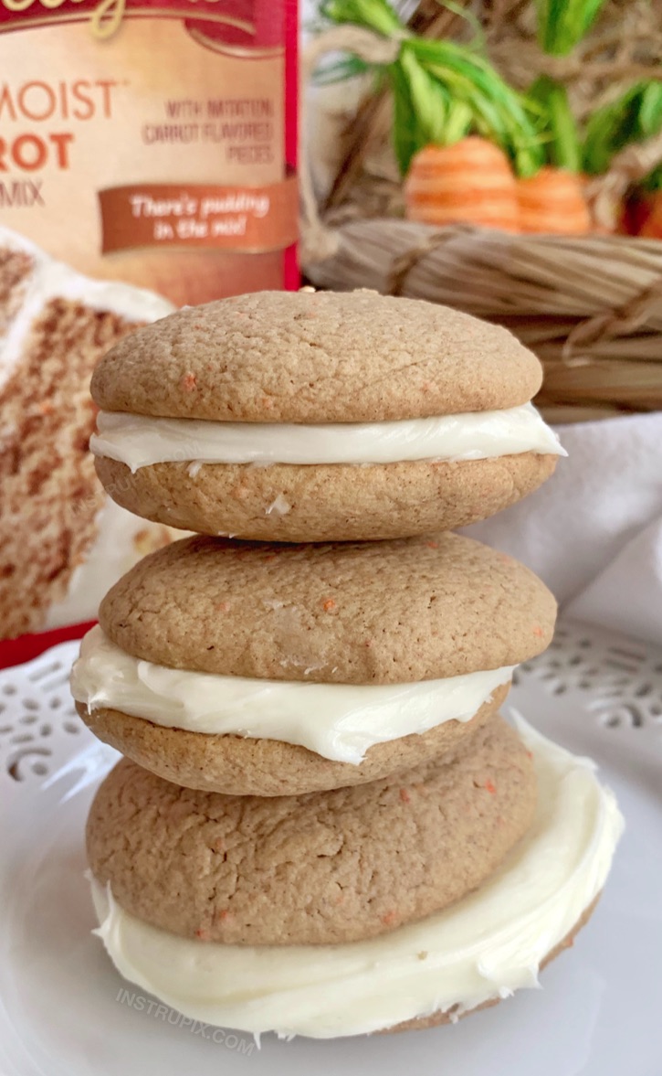 Quick & Easy Carrot Cake Sandwich Cookies made with just 4 ingredients! Cake mix, eggs, oil and cream cheese frosting! A unique cookie idea for spring or Easter.