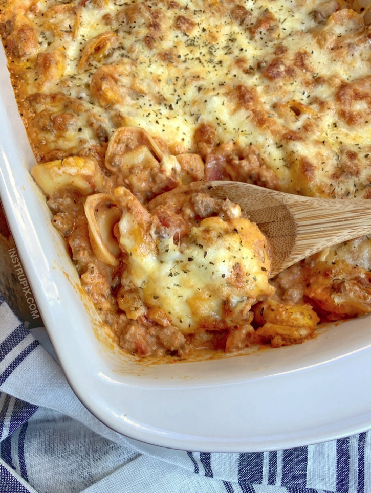 Quick, easy and cheap dinner idea for large families with kids! Even picky eaters love this recipe. Cheesy Baked Tortellini Casserole With Meat Sauce