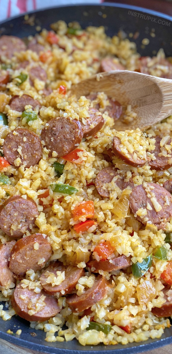 Quick, easy and healthy keto dinner recipe made with simple ingredients: frozen cauliflower rice, sausage, bell pepper, onion, cajun seasoning and oil. Delish!