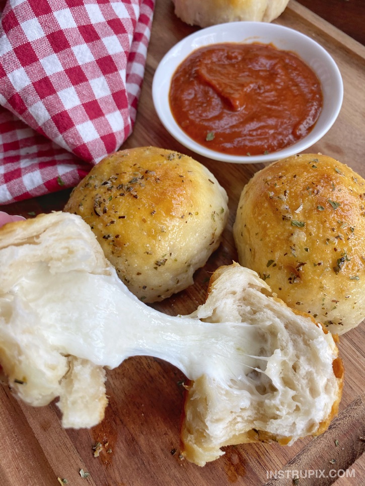 Cheese Stuffed Pillsbury Biscuits brushed with garlic butter. The BEST quick and easy snack or appetizer idea! Some serious comfort food. 