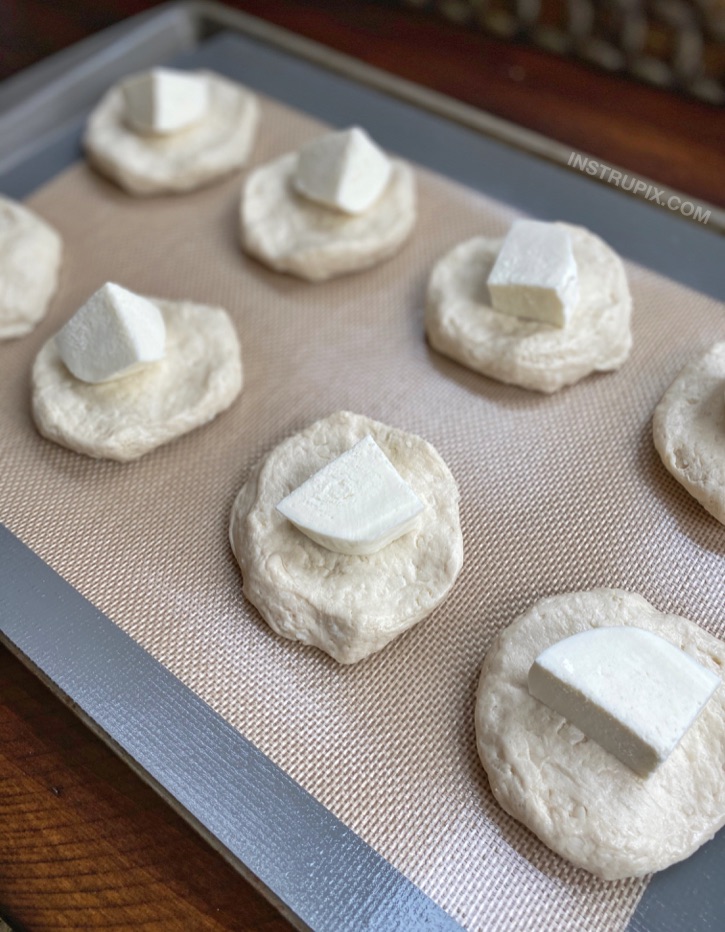 The BEST comfort food recipe! Garlic Butter Cheese Bombs made with Pillsbury biscuits, mozzarella and butter. A delicious snack, party food, and game day appetizer.