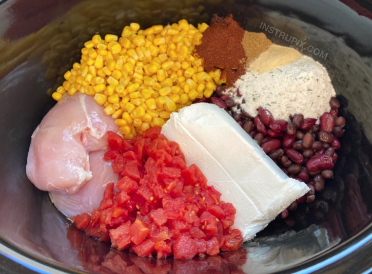 Slow cooker creamy chicken chili recipe -- Quick and easy family dinner recipe for busy weeknight meals!