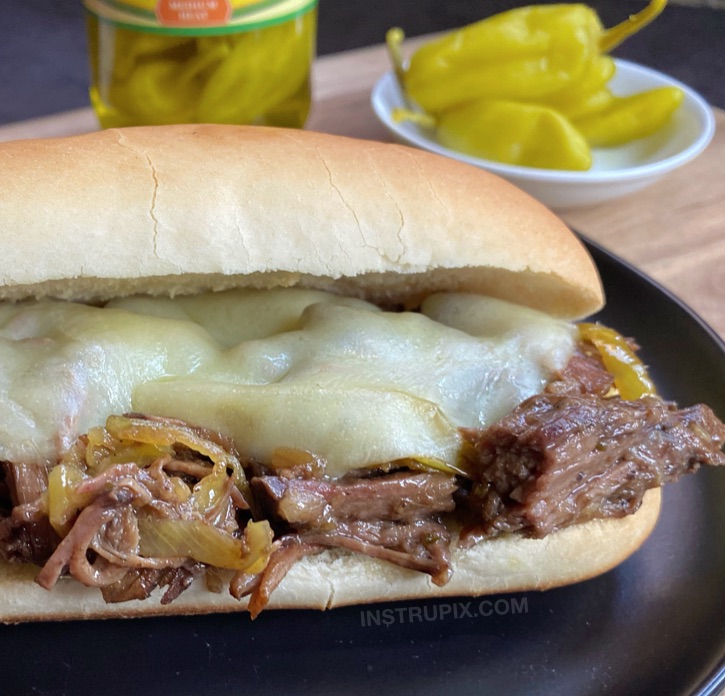Easy Pot Roast Sandwiches Recipe -- A family favorite crockpot beef dinner idea made with just 5 ingredients! If you're looking for easy slow cooker meals, add this beef recipe to your week night dinner menu.
