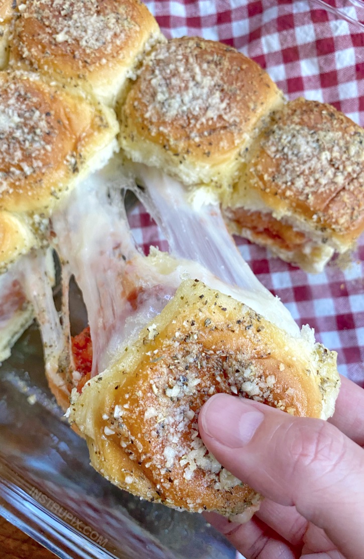 Easy Chicken Parmesan Sliders Recipe Made with Hawaiian Rolls & Frozen Chicken Nuggets. A super cheap and easy dinner recipe for your picky eaters! Your entire family will love this simple meal.