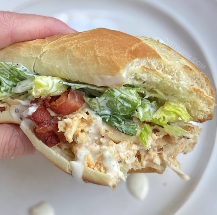 Easy Slow Cooker Shredded Chicken Sandwiches (made with cream cheese, cheddar, ranch, bacon and lettuce!)