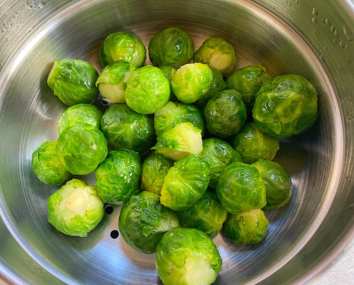 Steamed and then smashed Brussels sprouts for roasting. 