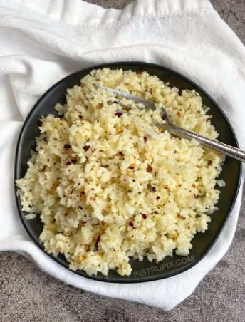 Keto Side Dish Ideas (Garlic Parmesan Cauliflower Rice) Quick and easy to make with frozen cauliflower rice! The best side dish for any low carb meal.