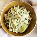 Cilantro Lime Cauliflower Rice -- This low carb side dish goes well with any Mexican inspired meal! It's quick and easy to make with frozen cauliflower rice.