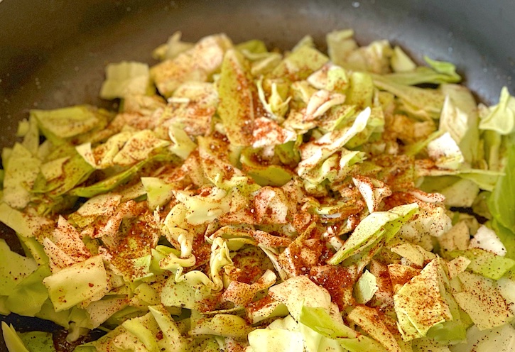 Easy and cheap cabbage dinner idea! This low carb dinner skillet is filled with cajun sausage and is super easy to make. 