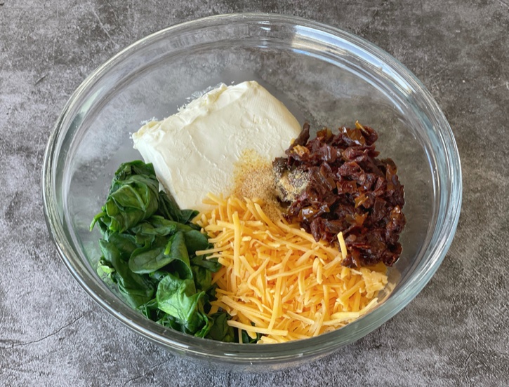 Yummy Cream Cheese Baked Chicken Breasts (with spinach, sun-dried tomatoes, and cheddar cheese). A low carb family friendly dinner idea!