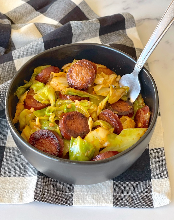 easy low carb dinner idea! cajun sausage and cabbage dinner skillet made with just a few cheap and healthy ingredients. 