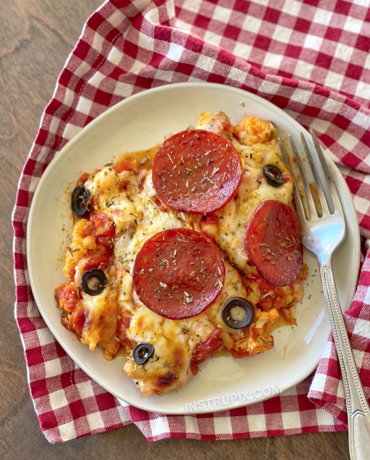 Quick and easy low carb dinner idea! This cauliflower pizza casserole is so simple to make with just a few ingredients and the pizza toppings of your choice. It's healthy, keto friendly, and super delicious! Even my picky family loves it. Effortless to make in just one dish.
