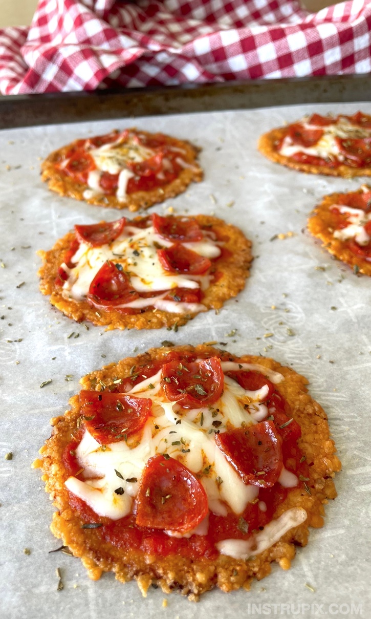 Crispy Oven Baked Mini Pizzas | A super quick and easy keto snack or even last minute meal idea! These are so simple to make with just cheese, sauce, and pepperoni. If you're looking for fun and easy low carb recipes, everyone loves these little pizzas!