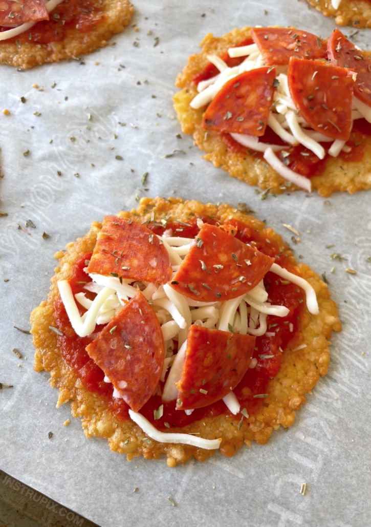 Crazy easy crispy mini pizzas made with a toasted parmesan crust! Fun and simple to bake in your oven in less than 15 minutes. These are great as a crunchy snack or even quick lunch! Serve them with a side of salad for a complete meal. 