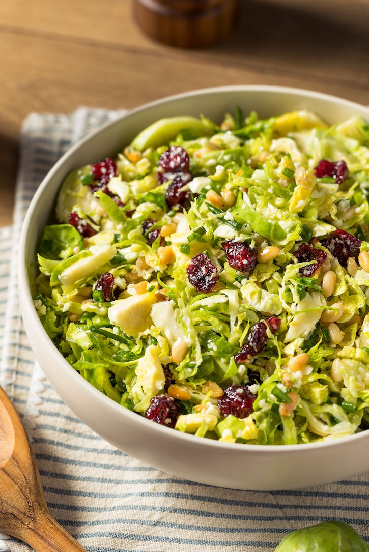 This shredded Brussels sprouts salad is my absolute favorite healthy side dish! It's tossed with a fresh homemade dressing, a toasted pine nuts, cheese and sweet dried cranberries. 