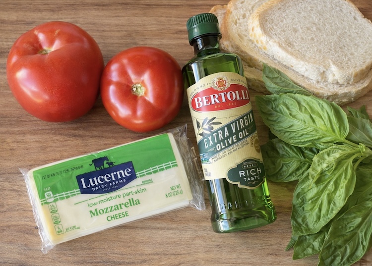 How to make caprese toast with cheese, tomatoes, basil, and garlic olive oil. 