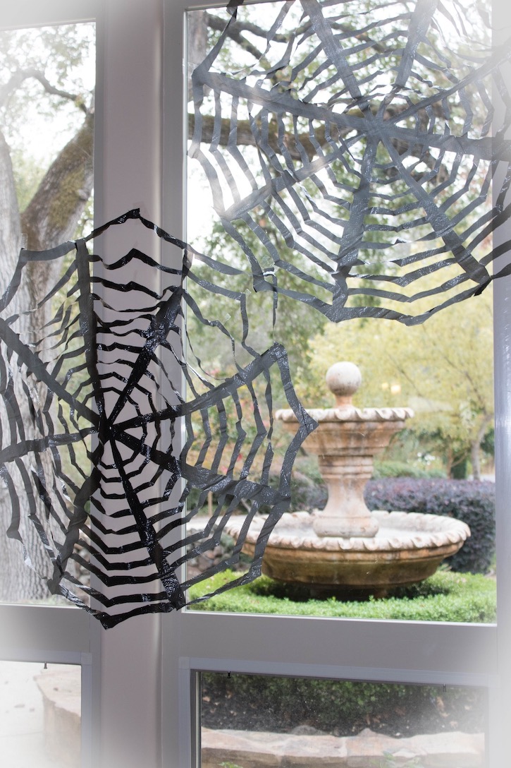 DIY Trash Bag Spiderwebs are the perfect quick and easy indoor and outdoor spooky home decor for Halloween! 