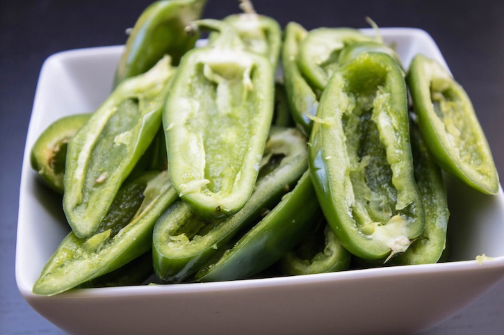 Jalapenos sliced in half ready for stuffing. 