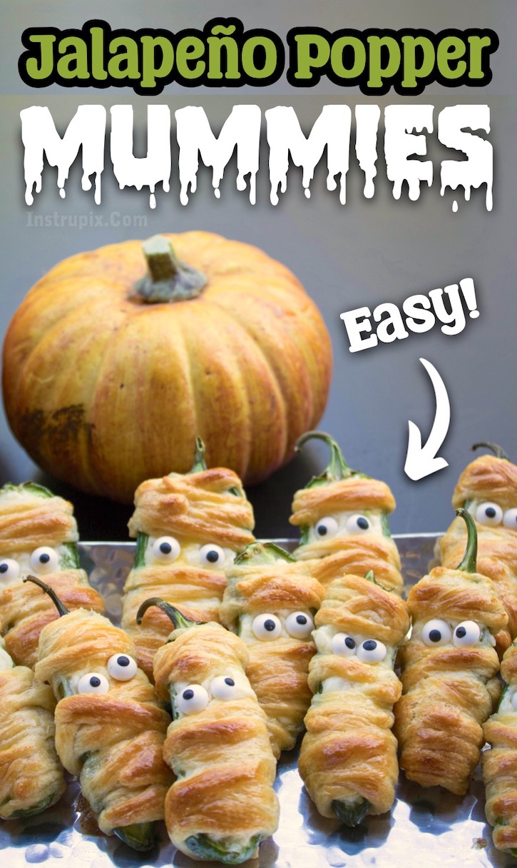 Easy Jalapeño Popper Mummies Appetizer made with crescent dough! This fun Halloween recipe is made vegetarian with a mixture of cheeses stuffed into peppers and then wrapped with Pillsbury crescent dough. Delicious finger food for adults! They look awesome as a display on your appetizer table-- both cute and creepy at the same time. 