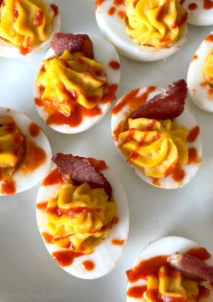 These Chickfila Sauce Deviled Eggs are a unique and fun appetizer for a crowd! Easy to make ahead of time with just a few simple ingredients including sriracha and crispy savory bacon. 
