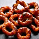 Delicious oven baked or air fried bacon onion rings brushed with bbq sauce.