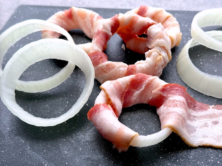 Recipe: How to make bacon wrapped onion rings with a large yellow onion, bacon, and bbq sauce. 