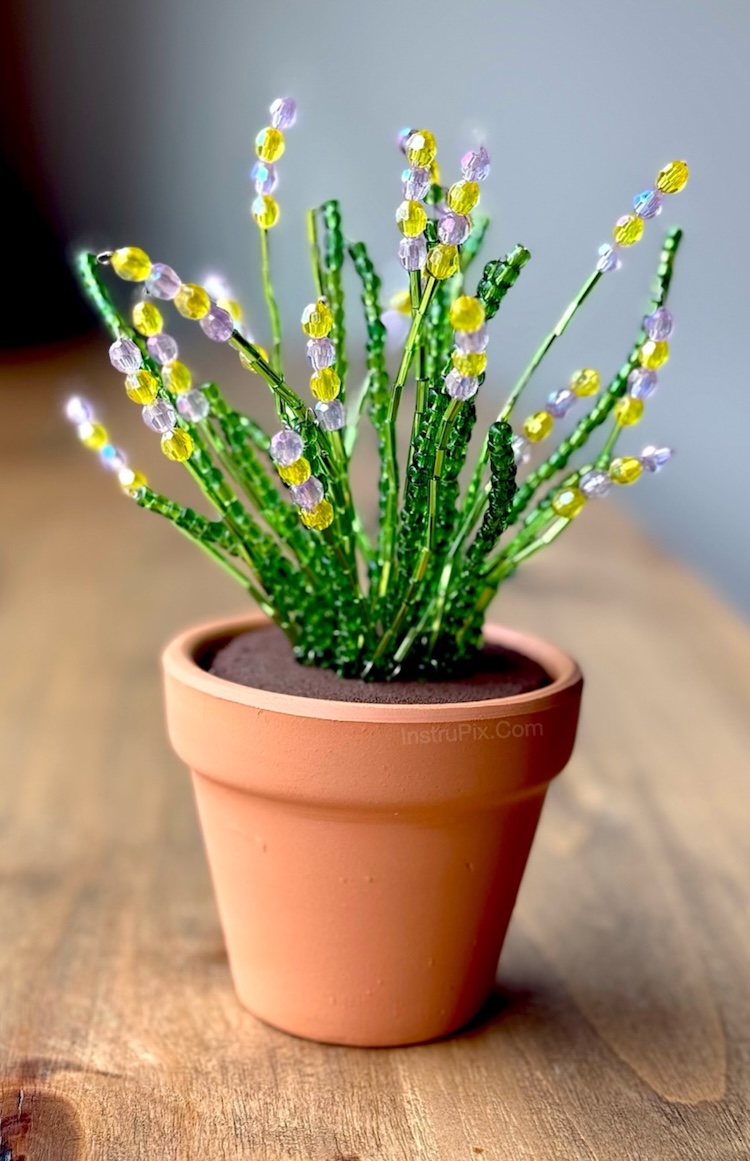 DIY plant craft made with small clay pots, beads, and wire. This creative project is perfect for adults to make at home. They make for lovely handmade gifts for Mother's day, birthdays, teachers, and more.